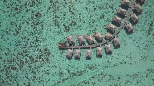 Aerial View of Luxury Waterfront Bungalows in Tropical Paradise