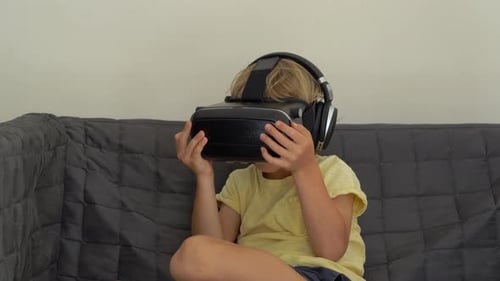 Child Immersed in Virtual Reality Gaming at Home