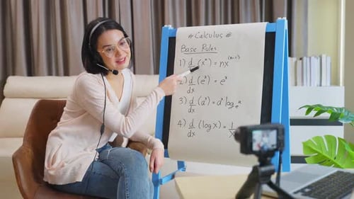 Asian school young woman teacher working from home teach virtual online math subject to student.
