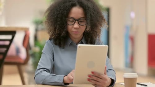 Woman Using Tablet in Office Workplace