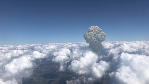 Large mushroom cloud explosion or volcano over Clouds