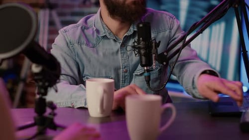 Closeup of Online Radio Station Host Recording Podcast Interview with Guest in Online Talkshow