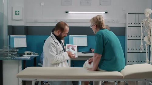 Doctor Explains Human Heart to Patient in Clinic