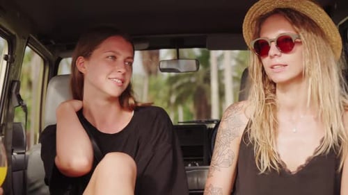 Two Women Enjoying Tropical Trip in Jeep