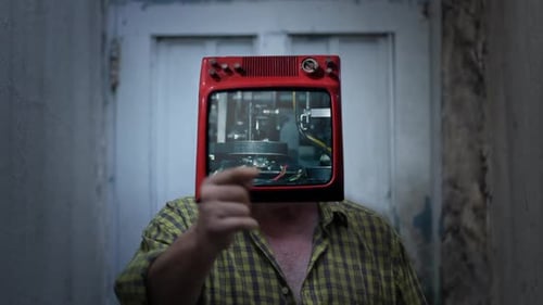 Man with Television Head in Interior