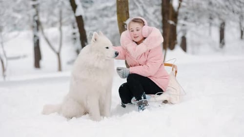 Girl with Dog in Winter