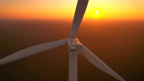 Scenic Wind Turbines Spinning During Golden Sunset Aerial View