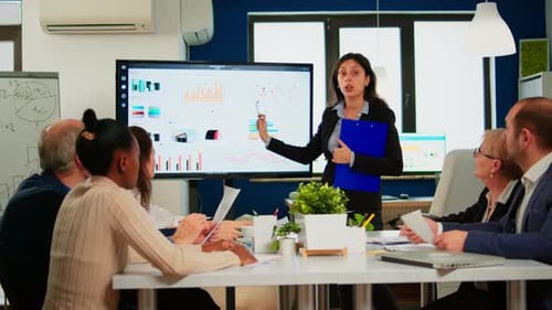Business Colleagues Having a Data Presentation in Office