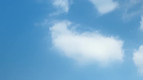 Fluffy Clouds Drifting in Blue Sky Time Lapse