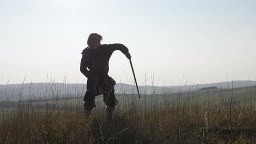 Warrior Practices Sword in a Rural Landscape