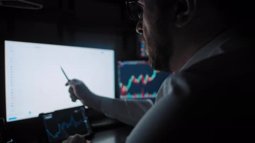 Man Analyzes the Stock Market