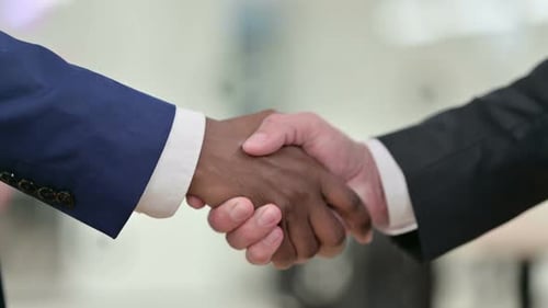 Business Handshake in Office Environment