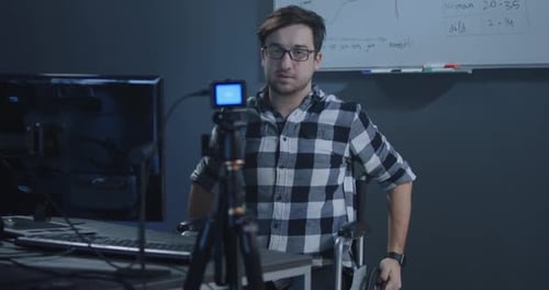 Young Adult Vlogging in Office Setting