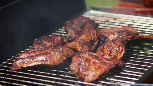 Tasty Ribs Cooking on Barbecue Grill for Summer Outdoor Party