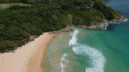 Aerial view of white sand beach and ocean wave