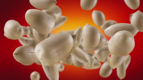 Peanuts Spinning on Blurred Red and Yellow Background