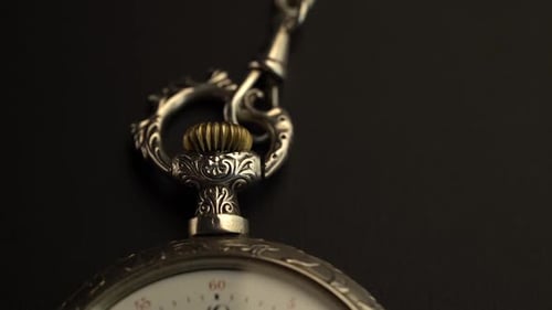 Pocket Watch with Vintage Design Closeup Black Background