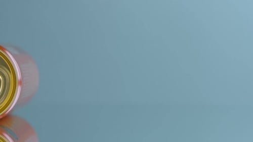 Close-up of Red Drink Can on Reflective Surface