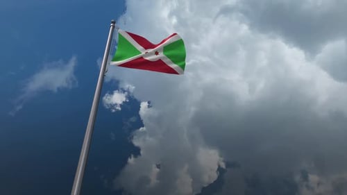 Realistic Burundi Flag Waving in Cloudy Blue Sky
