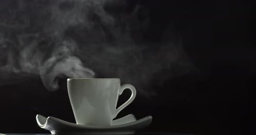 Steaming Coffee Cup Lifted From Saucer