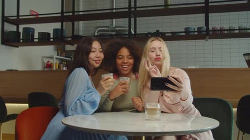 Carefree Diverse Women Making Selfie on Cellphone at Cafe