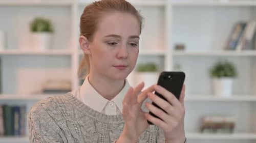 Portrait of Attractive Young Woman Using Smartphone