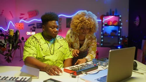 African American Musicians Working Together in Sound Studio