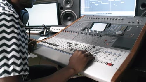 Audio Engineer Working at Recording Studio