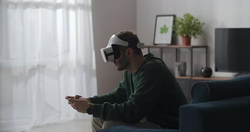 Man Using Virtual Reality Headset in Living Room