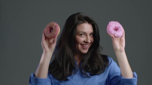 Woman Smiling with Donuts