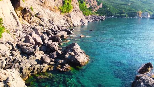 Coastline at Dawn Mountain and Rocks on the Seashore Turquoise Sea and Green Trees Huge Stone