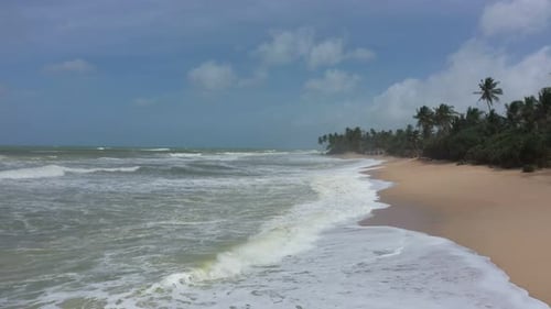 flying over the beach with waves