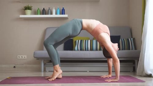 Fitness Woman Doing Gymnastic Bridge at Home