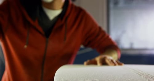 Man making surfboard 4k