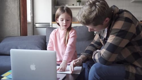 Kid Daughter Learning Virtual Online Class on Video Call with Dad at Home