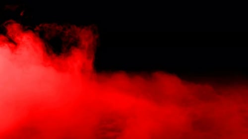 Red Smoke Clouds Against Black Background Animation