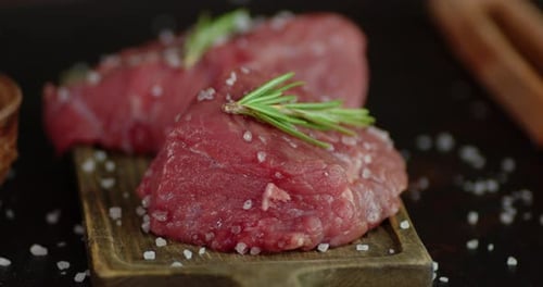 Fresh Raw Beef Steaks with Rosemary and Salt