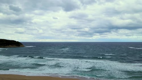 High and powerful waves coming fast to the beach, waves in winter day