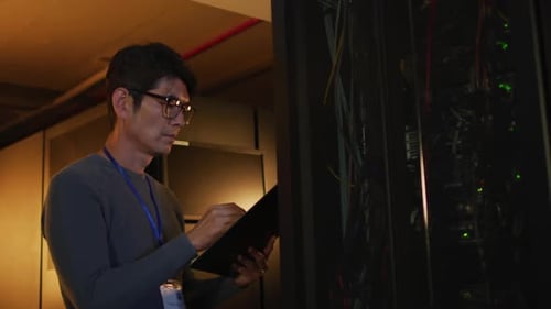 IT Technician Working in Server Room