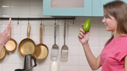 Two Young Adults Cooking Together and Making a Video