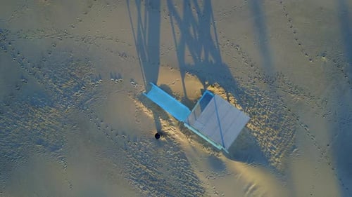 Aerial drone uav view of a lifeguard tower and the beach.