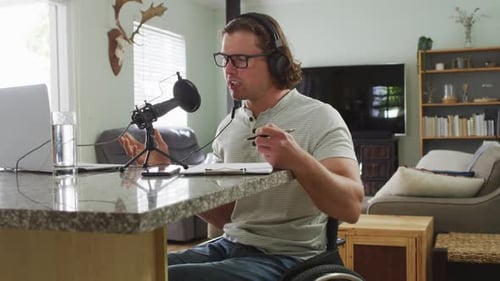 Man Using Microphone from Wheelchair for Broadcast