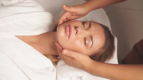 Gorgeous Woman Enjoys Spa Treatment in Clinic.