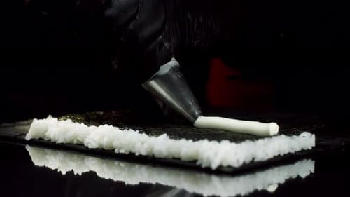 Sushi Chef Prepares Sushi With Cream Cheese