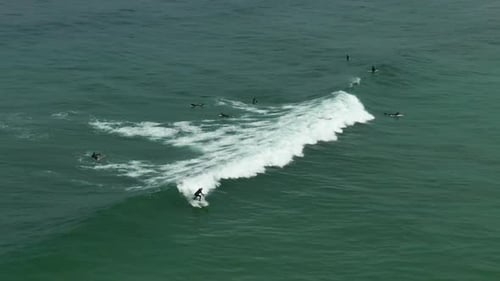 Surfer Rides a Wave in the Open Ocean