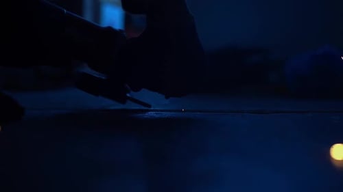 Sparks Fly From Grinding Wheel on Metal Surface