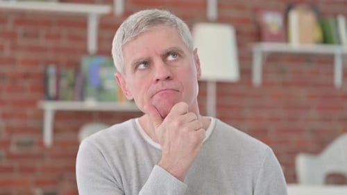 Gray Haired Adult Thinking Indoors