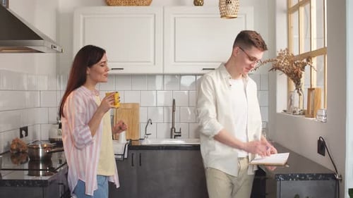 Couple Relaxing Together in a Bright Kitchen