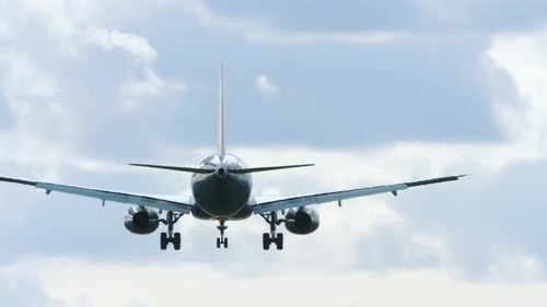 Airplane Descends for Landing Rear View