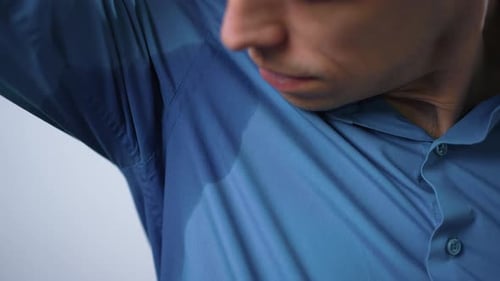 Sweaty Armpit on a Blue Shirt